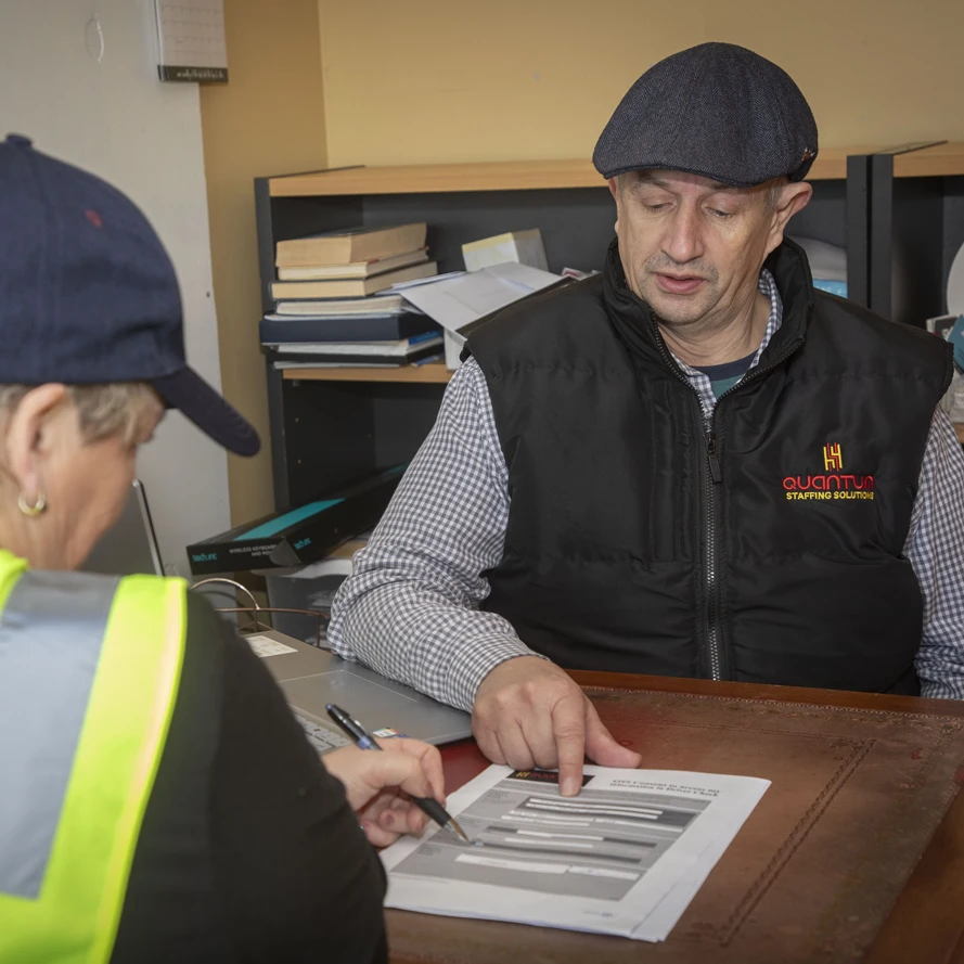 Jason from Quantum Staffing Solutions interviewing a job candidate in his office.
