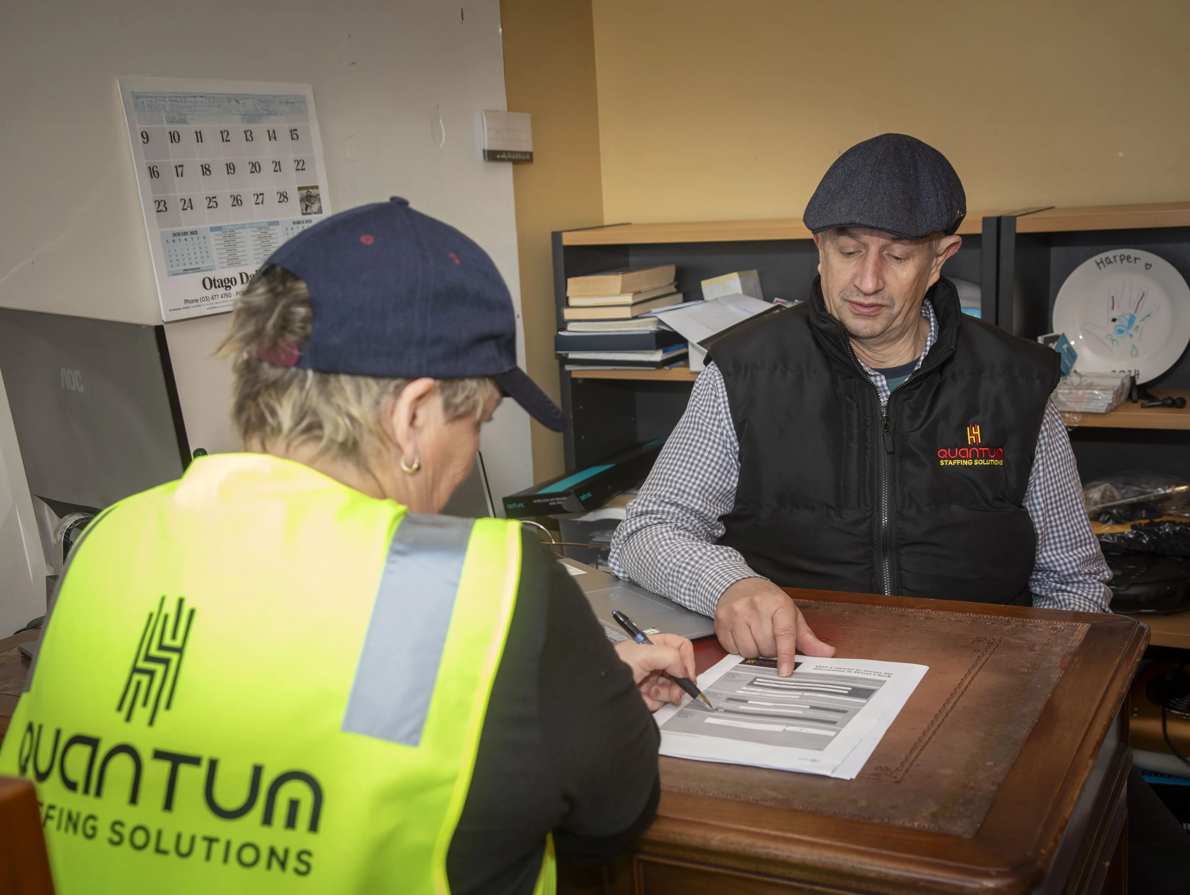 Jason from Quantum Staffing Solutions interviewing a job candidate in his office.