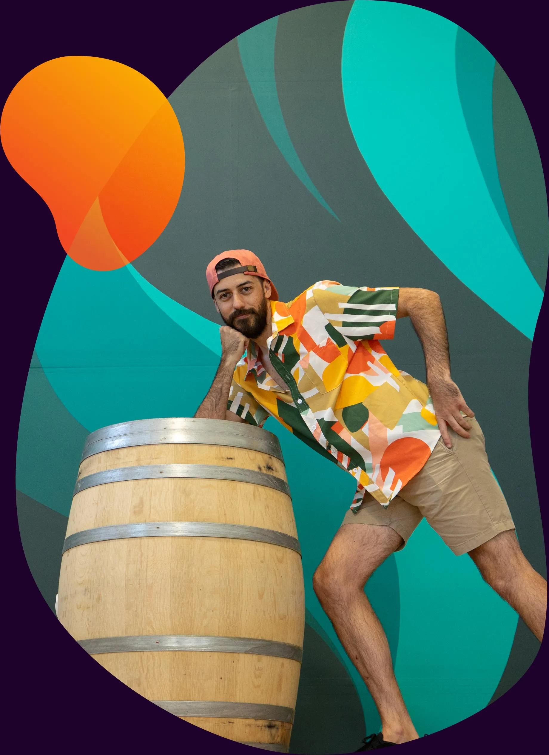 Adam Raiola leaning on a beer barrel