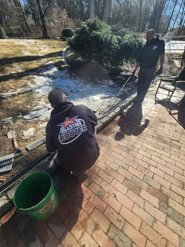 Outdoor trenching and pipe setup for French drain installation in Norwalk CT