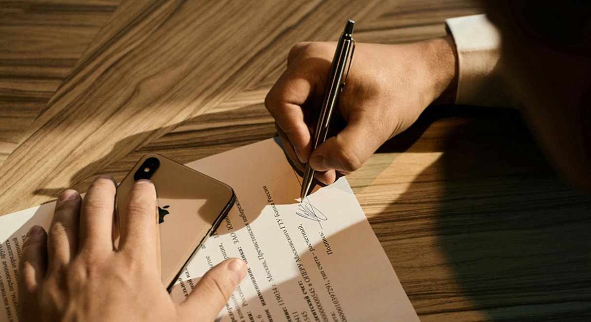 Person signing legal document