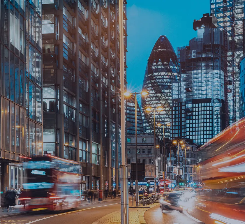 Busy city street with motion lights symbolizing fast-paced capital markets