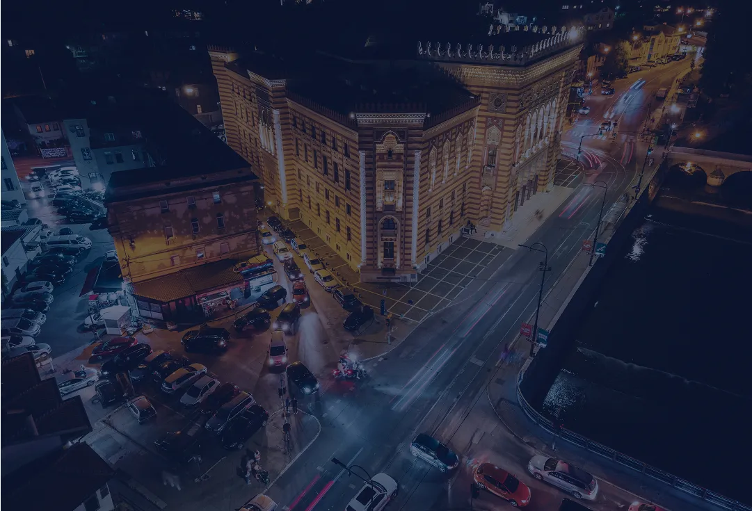 Aerial view of a financial district at night representing venture capital activity