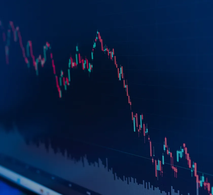 Declining stock market candlestick chart with red and green bars on dark blue background.