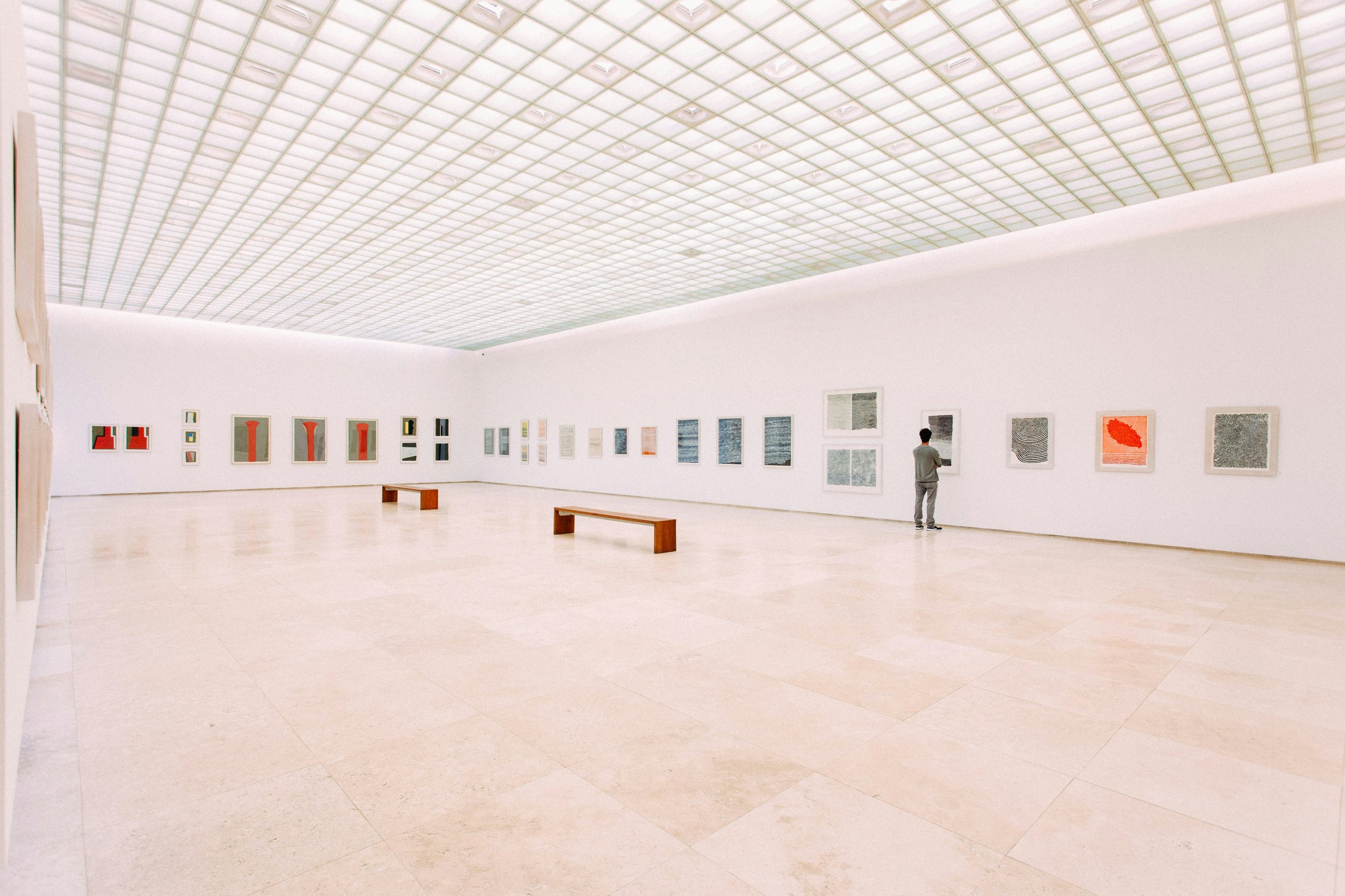 Contemporary museum hall with white walls and lighting