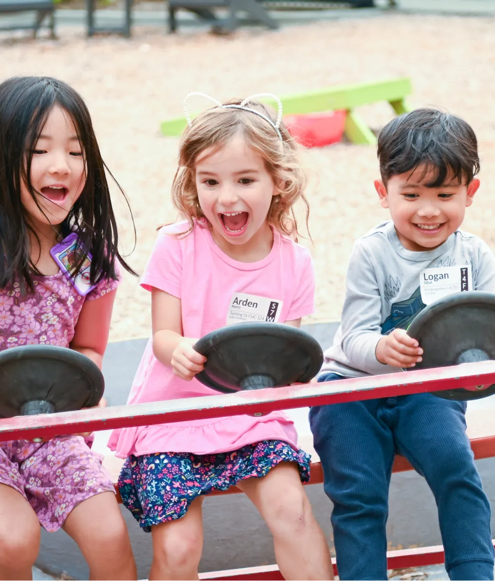 Three kids playing in the park.