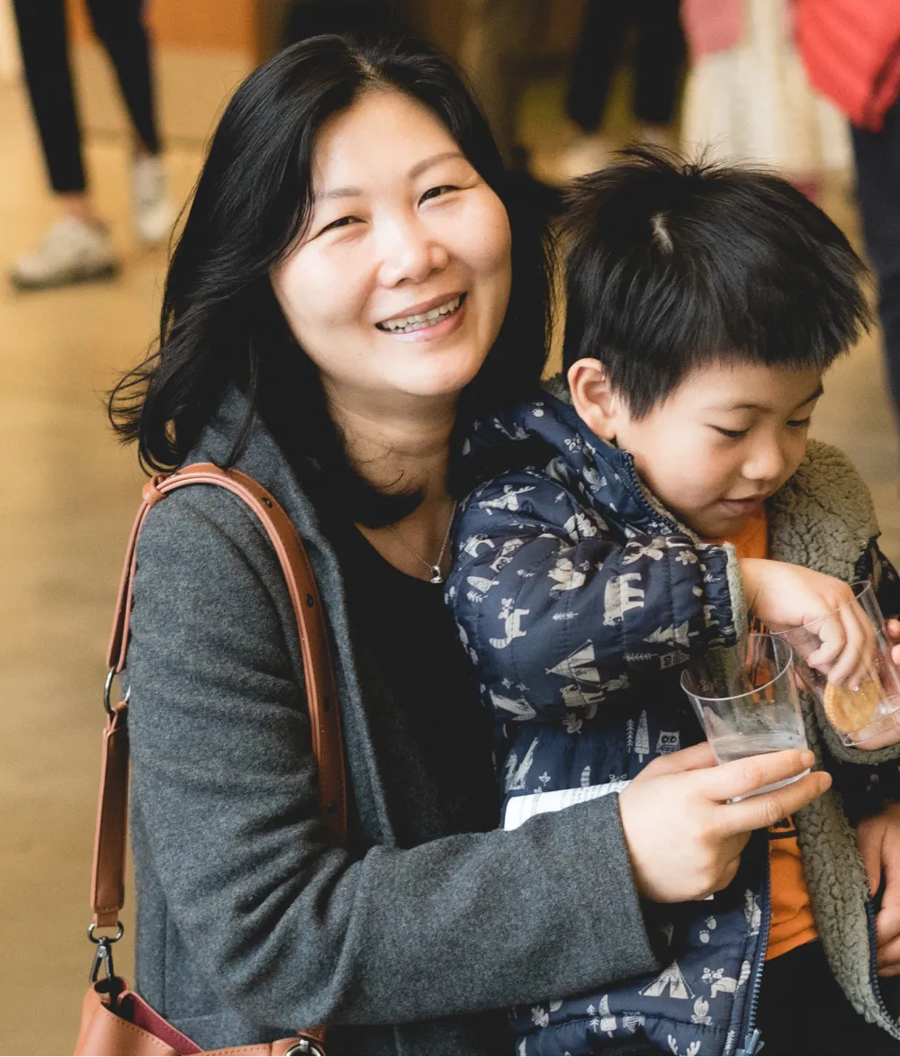 A women holding a boy.