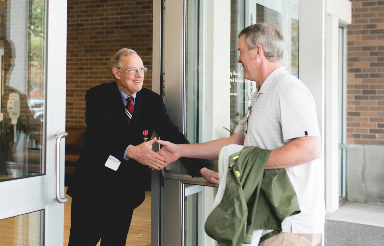 Two men shaking hands.