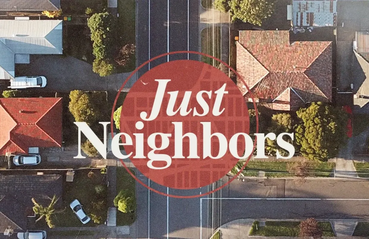 Aerial view of suburban neighborhood with red "Just Neighbors" overlay