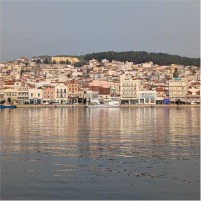 Coastal town with colorful buildings reflecting in calm water