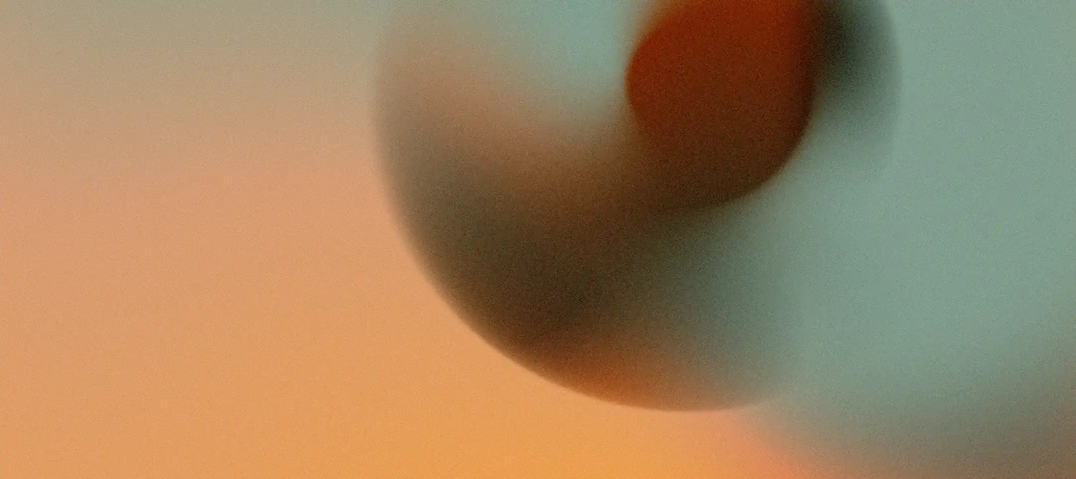 Blurred abstract sphere with gradient orange and teal colors