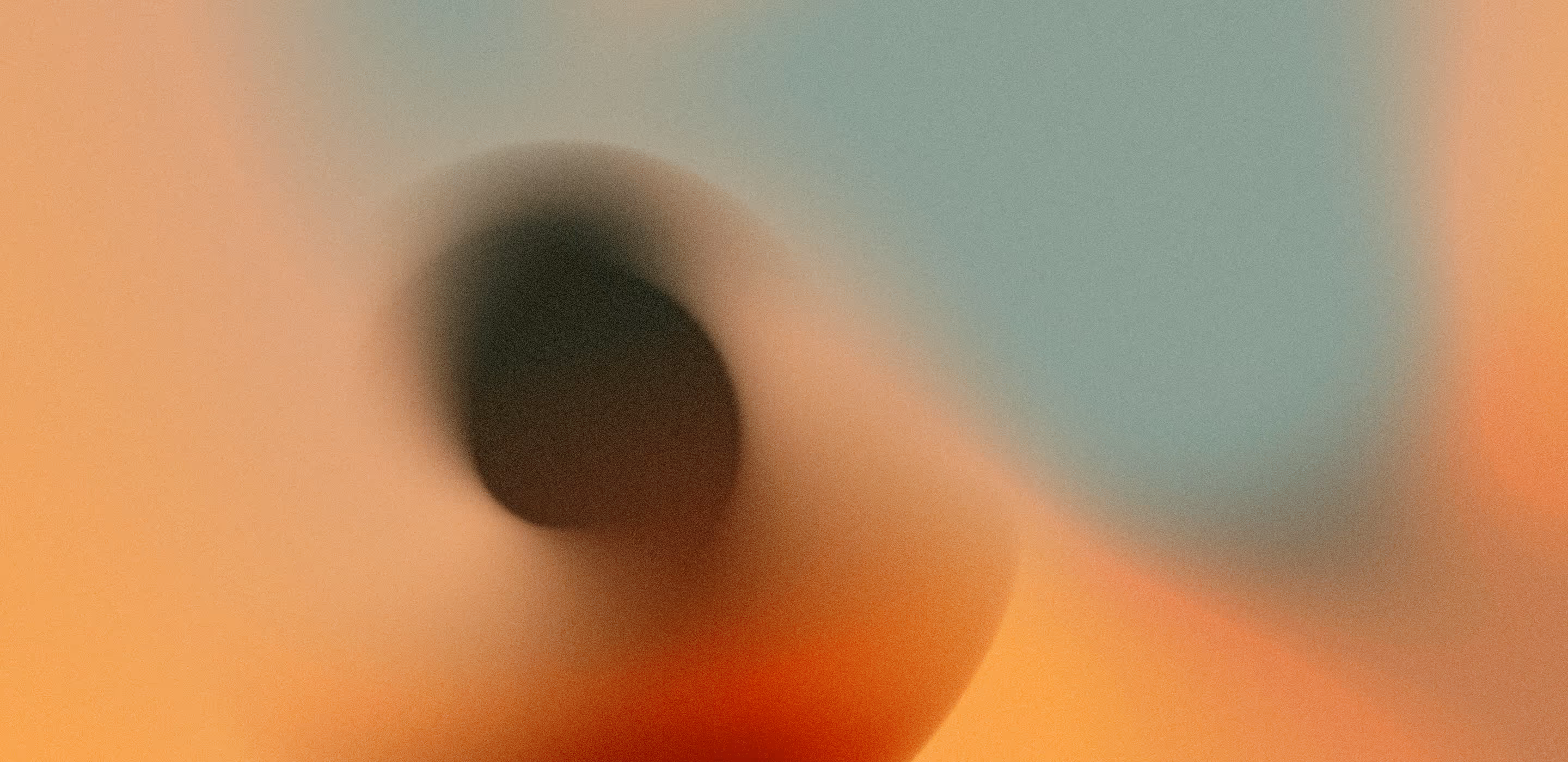 A blurry image of a black object on a yellow background.