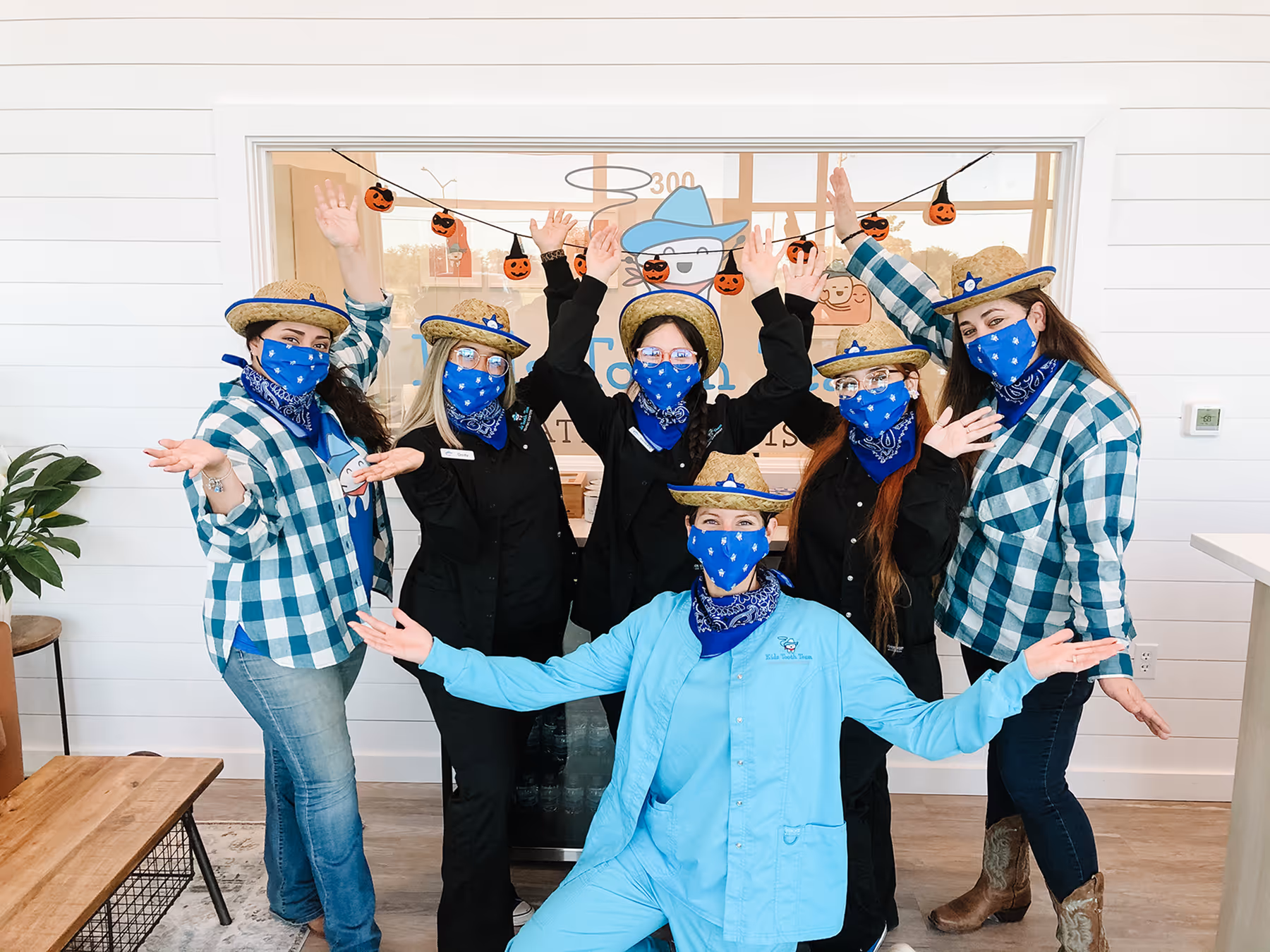 A group of people with masks on their faces.