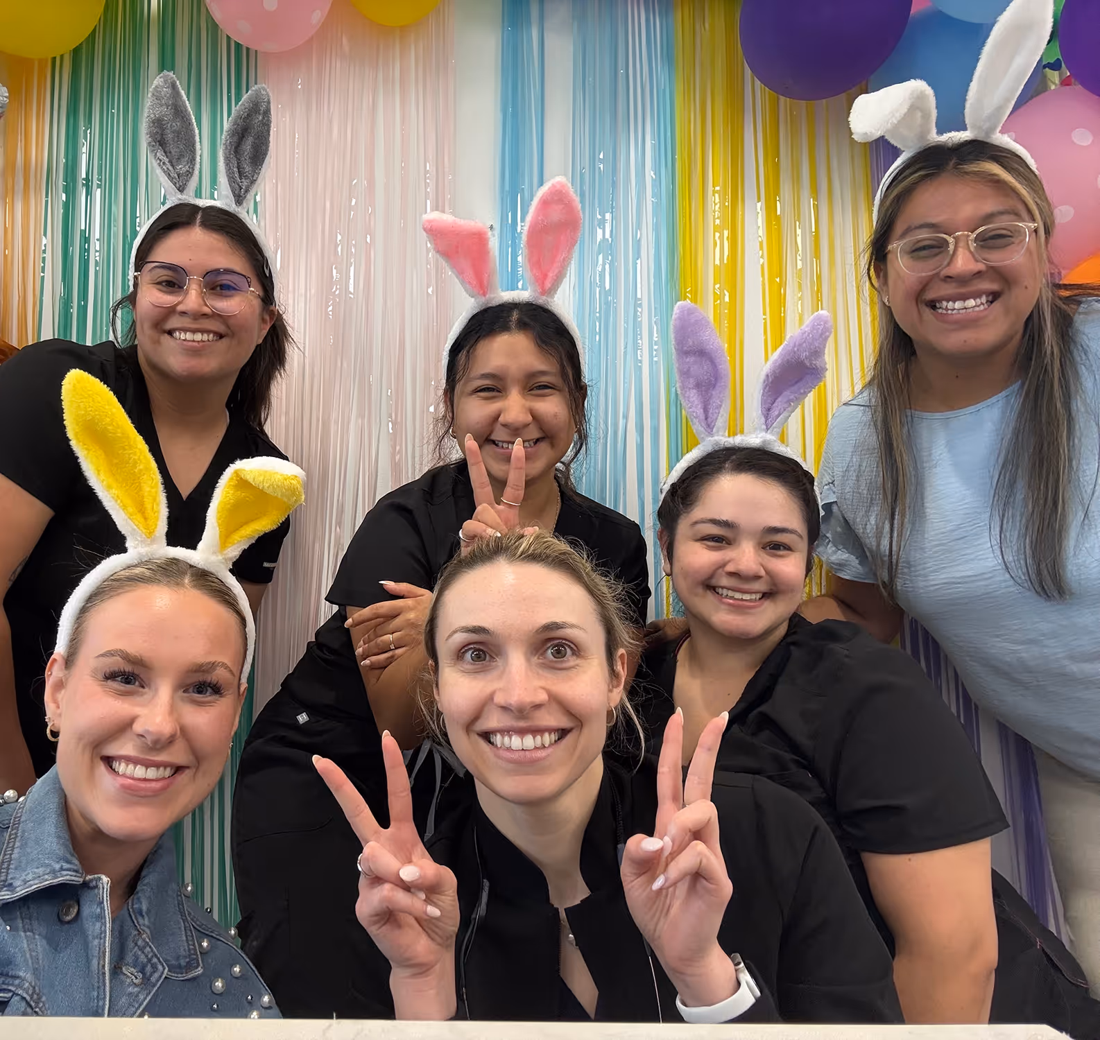 A group of women standing next to each other.