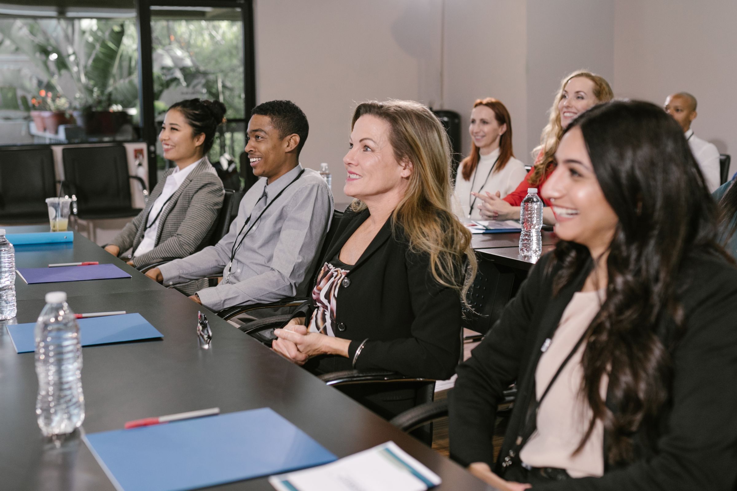 Students and parents seated together at a campus information session