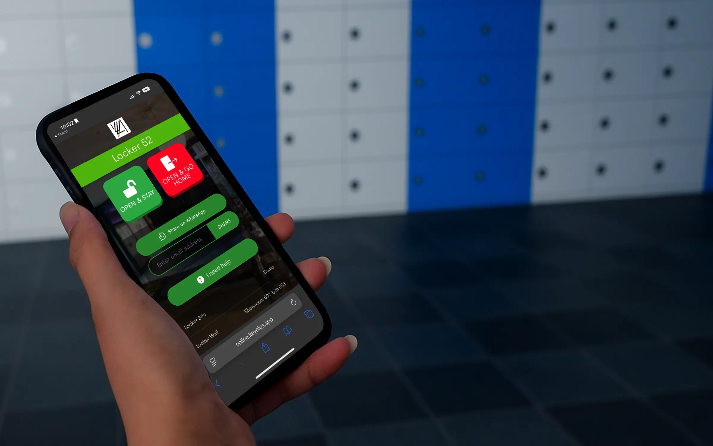 Hand holding a mobile phone, with a screen showing a smart locker prompt to access a locker, infront of a bank of smart lockers