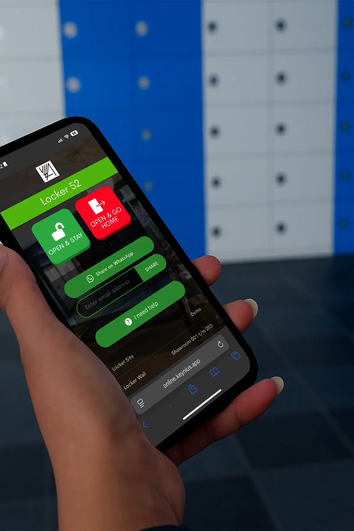 Someone holding a mobile phone with a prompt to open a smart locker, in front of a bank of smart lockers