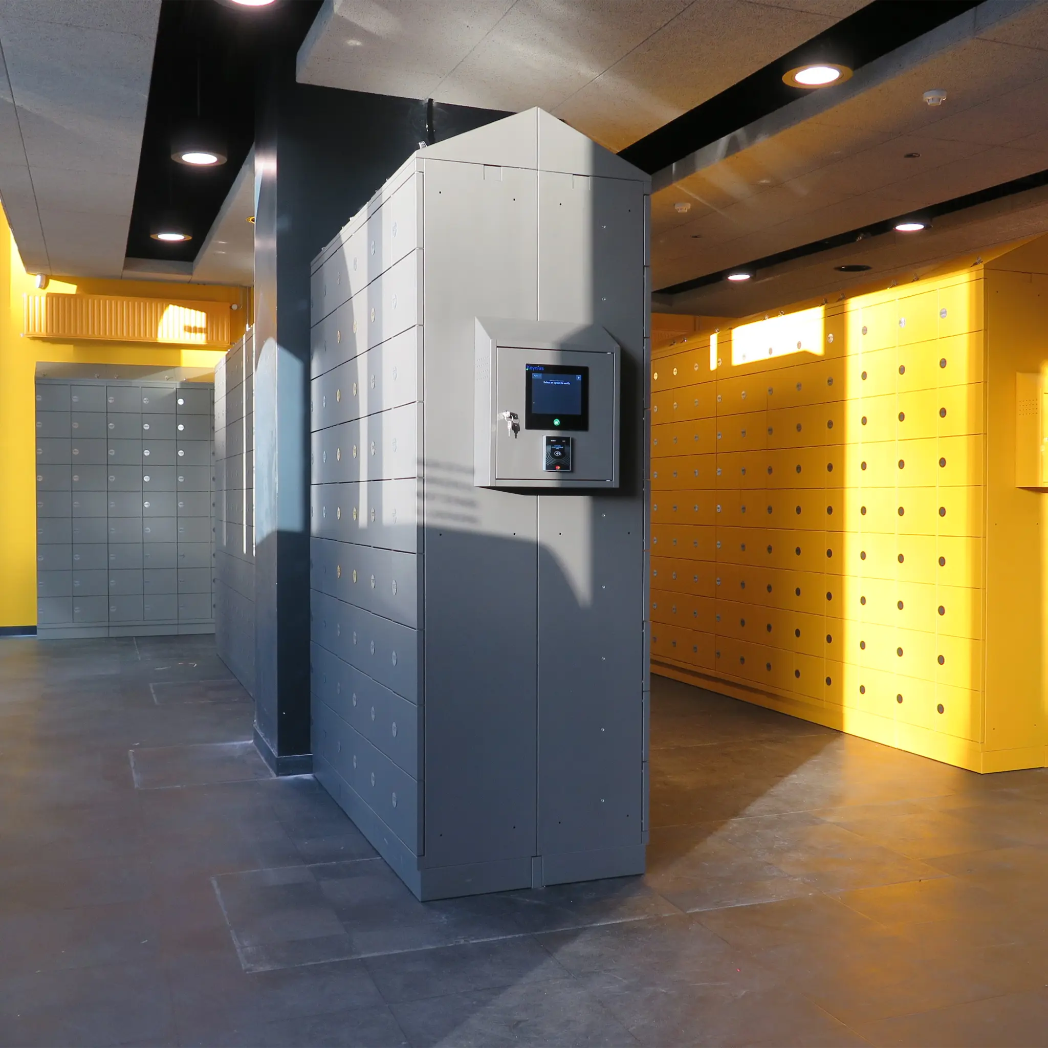 Bank of smart lockers in gray and yellow