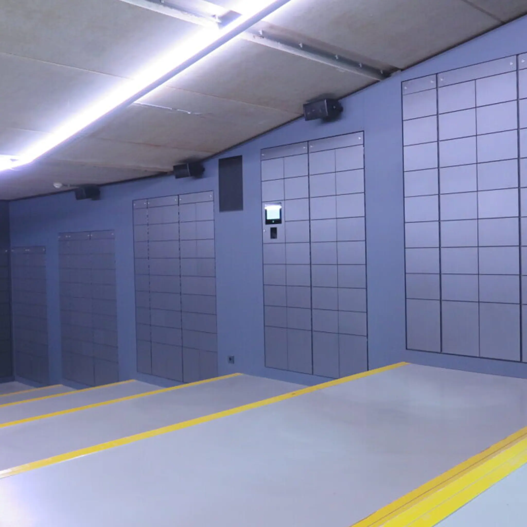 Cool venue with smokey blue smart lockers going down the stairs