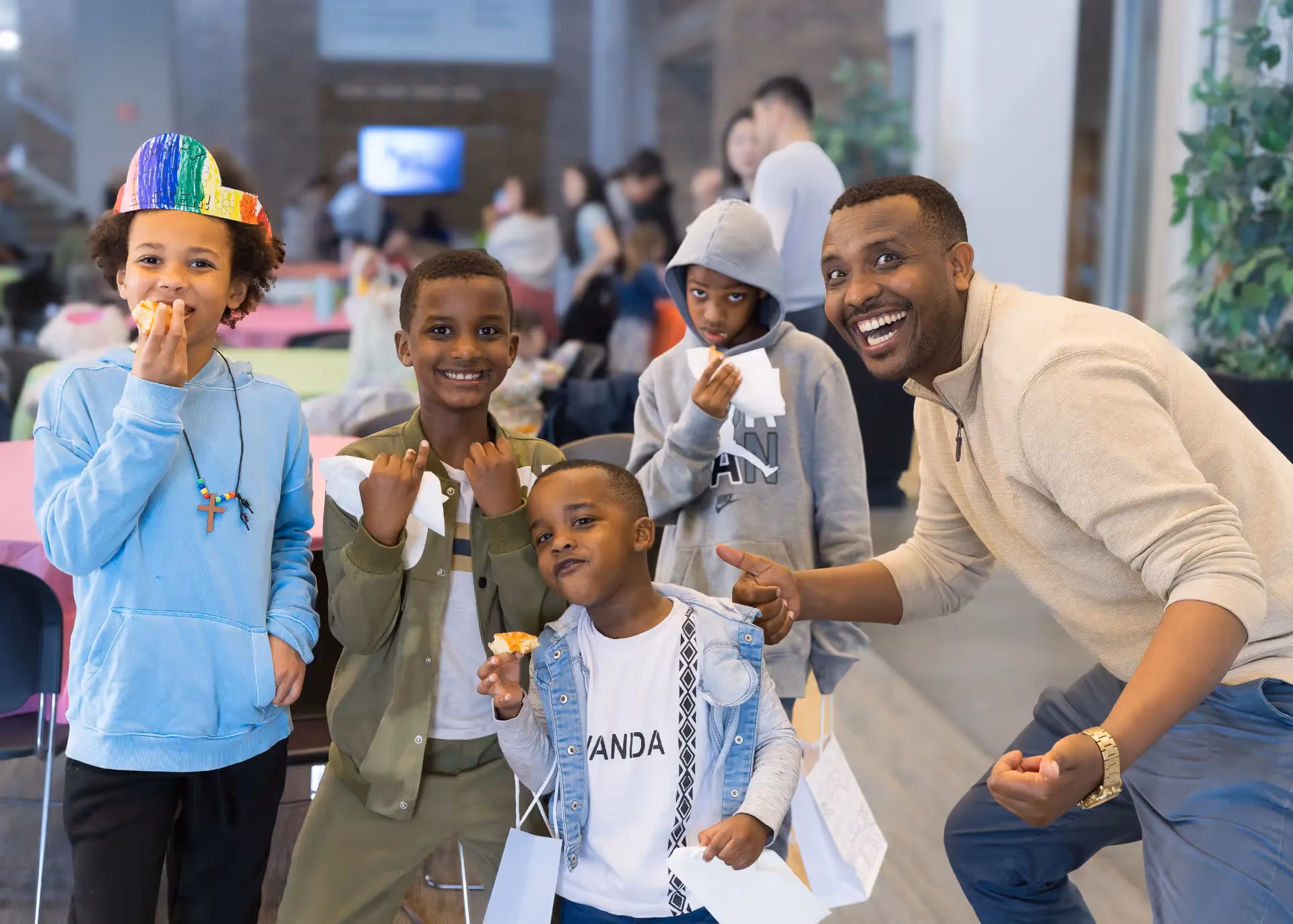 Kids and adults smiling.