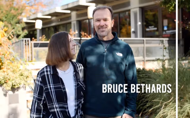 A women looking at a men and hug.