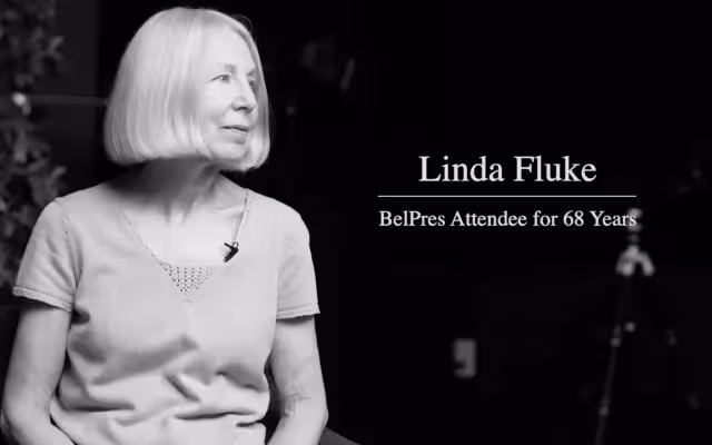 A black and white image of a women with white hair.