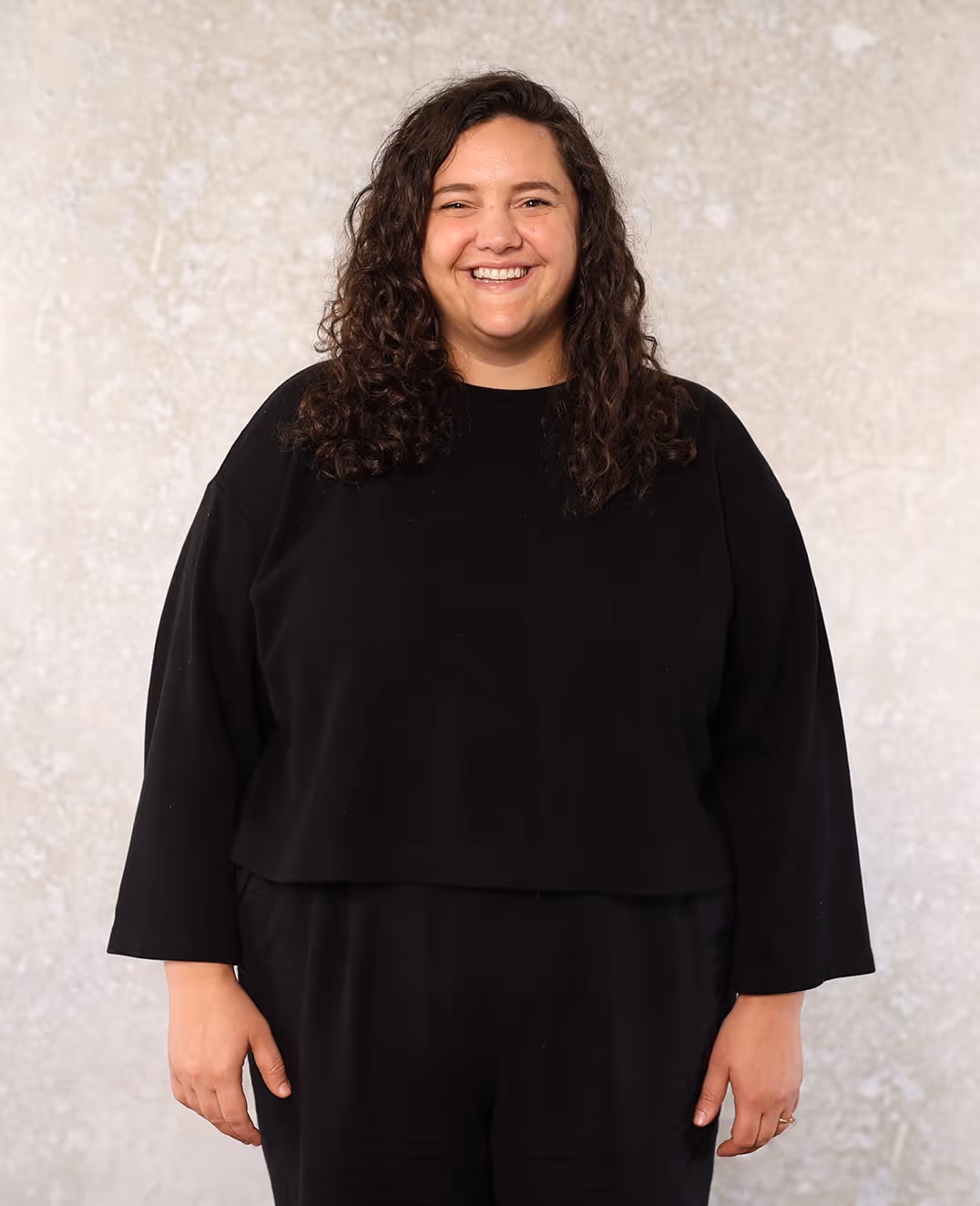 A headshot of Sarah Tria.