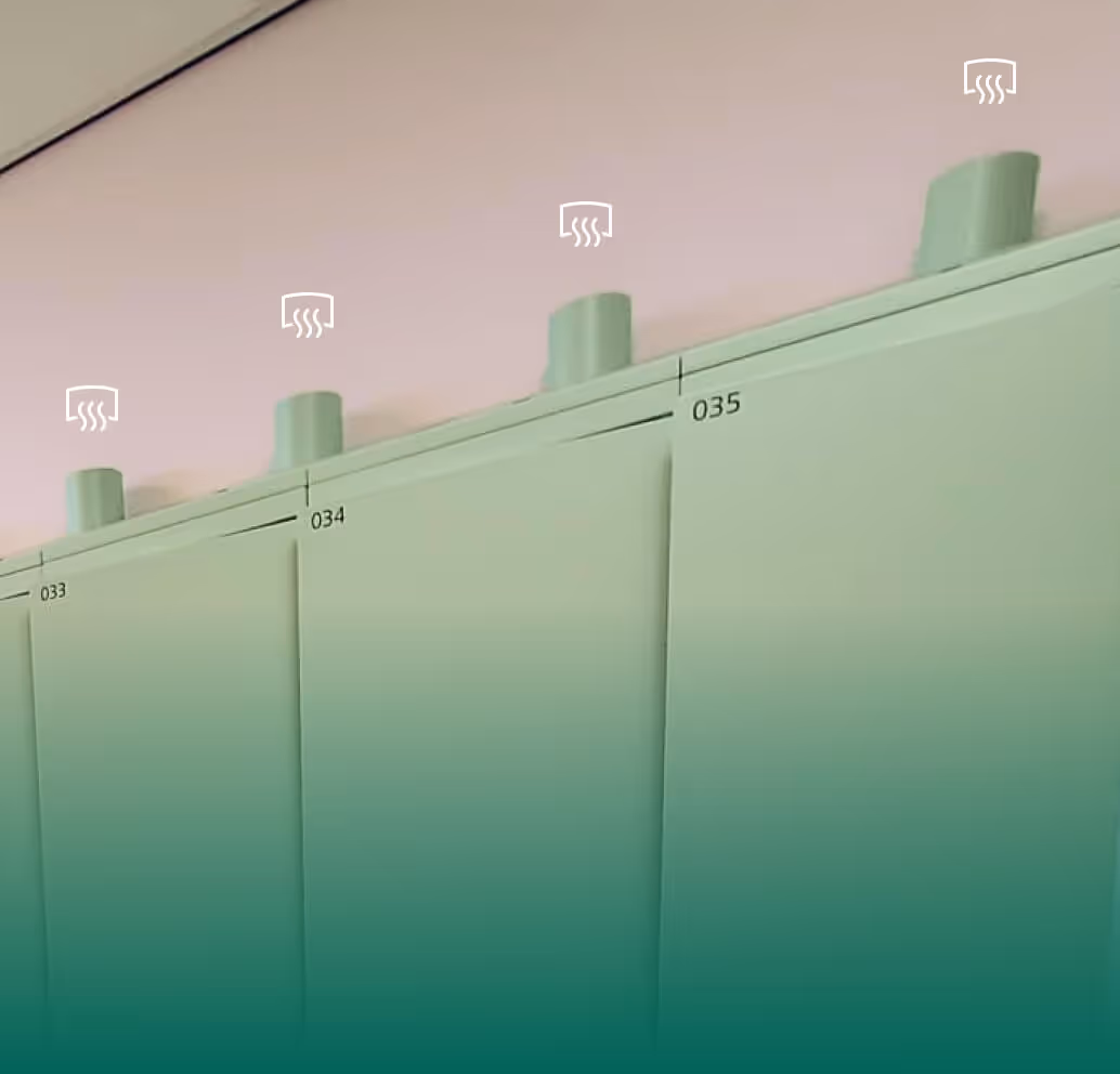 Close-up of pale green heating control knobs labeled 033, 034, and 035 on a panel.