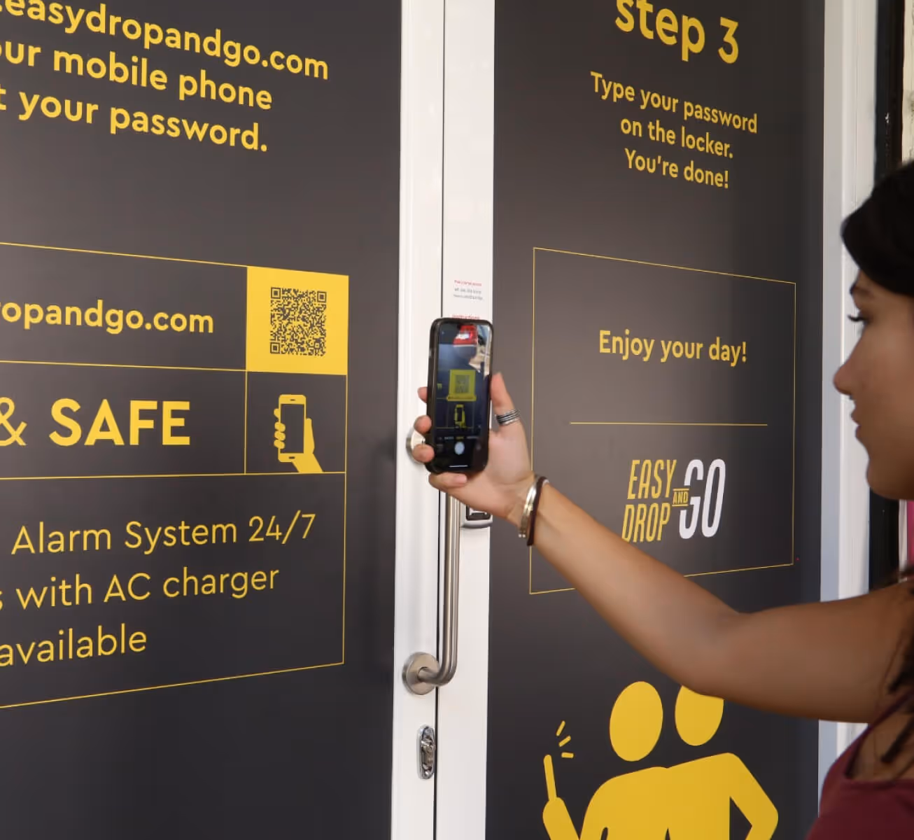 Person scanning QR code on a door with a smartphone to use Easy Drop and Go service.