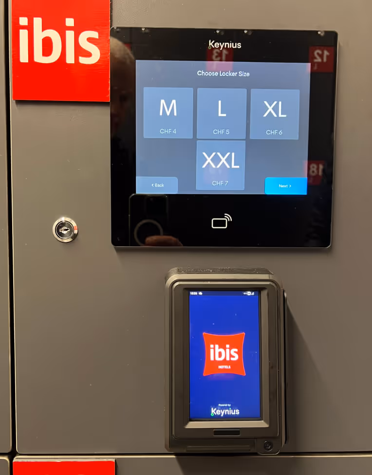 Digital locker system with ibis hotel branding displaying locker size options and prices in Swiss francs.