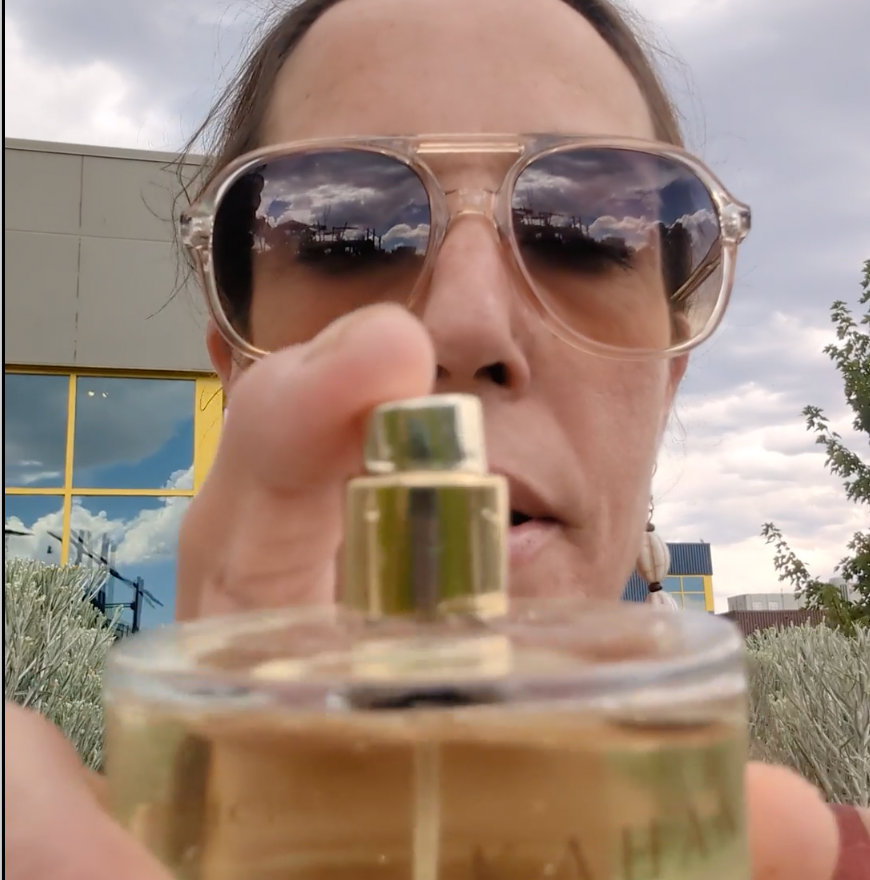 Woman showcasing a perfume