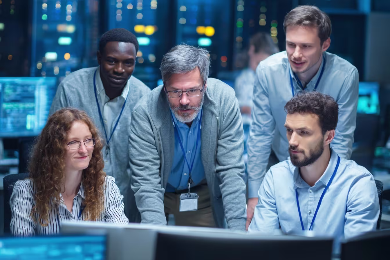 Diverse IT team discussing managed SIEM solutions