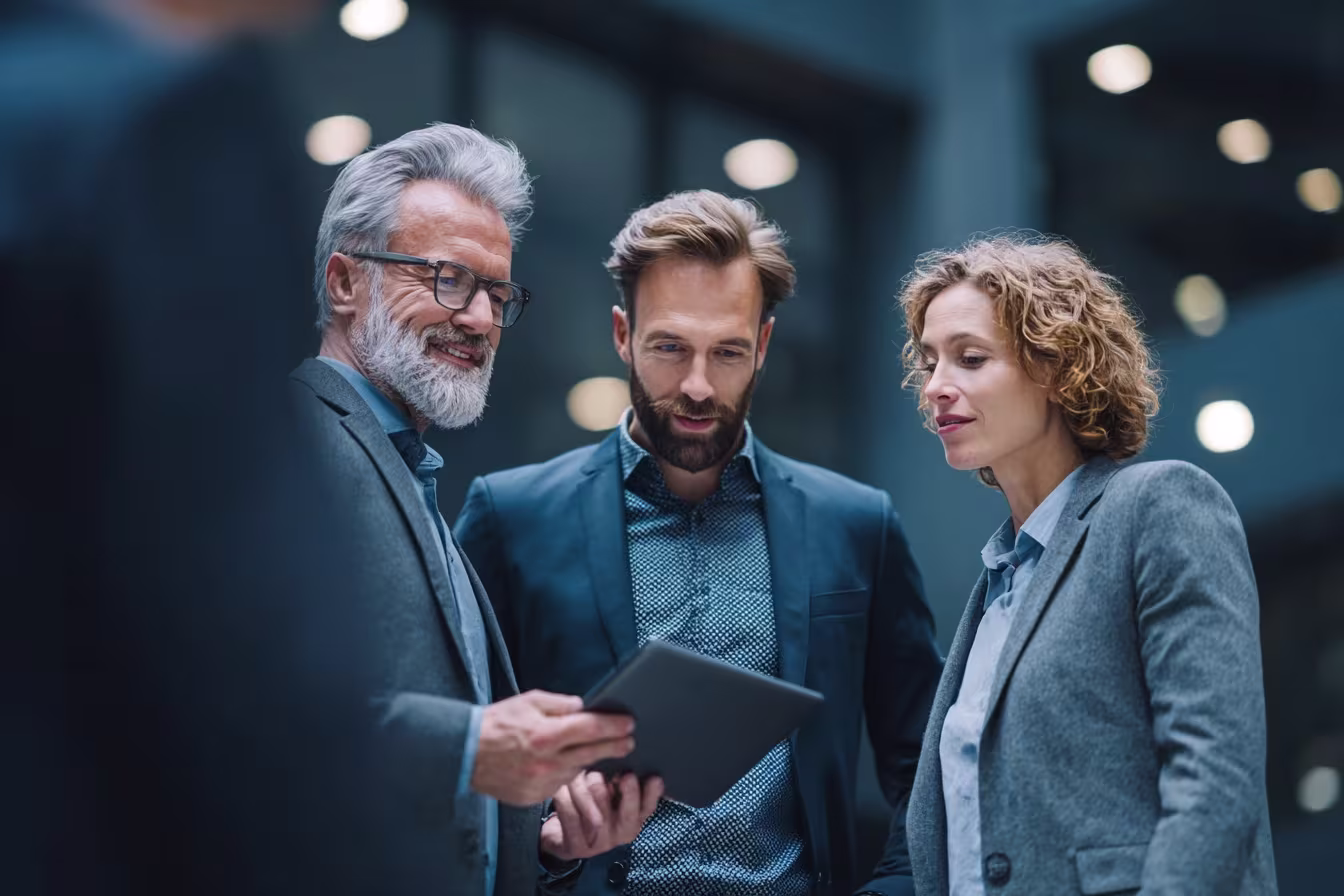 Professionals discussing IT asset management solutions