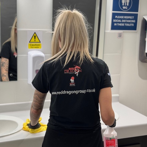 Red dragon employee cleaning sing.