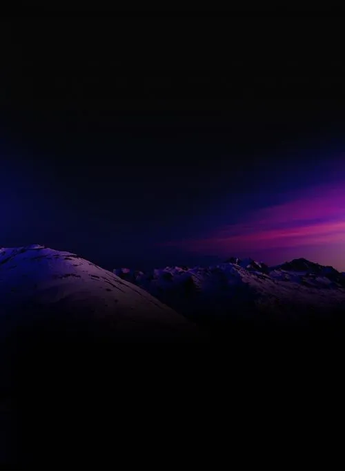 A sunset behind a mountain