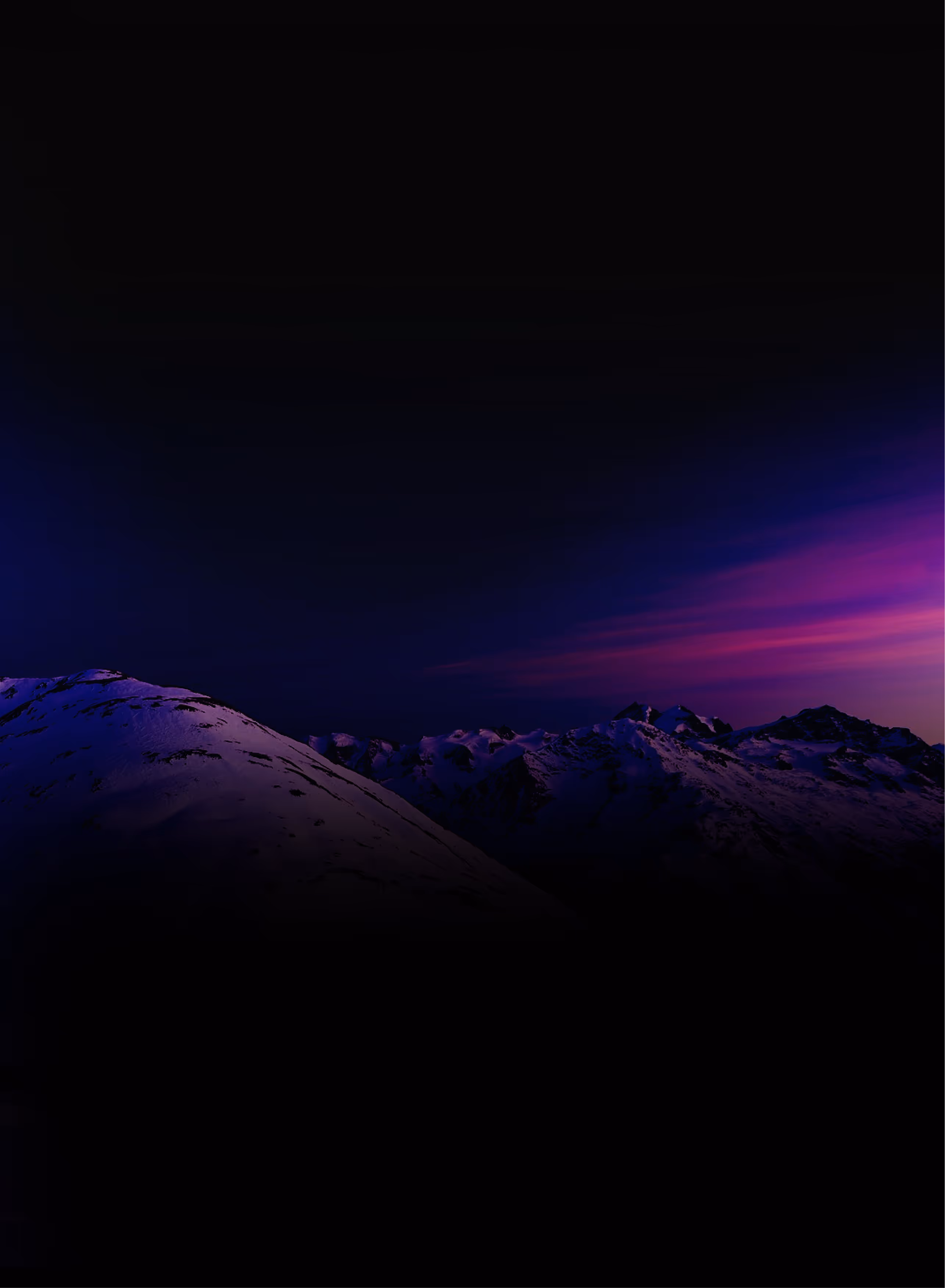 A sunset behind a mountain