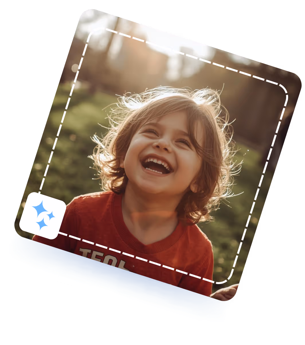 Smiling young child with light brown hair wearing a red shirt outdoors in natural sunlight.