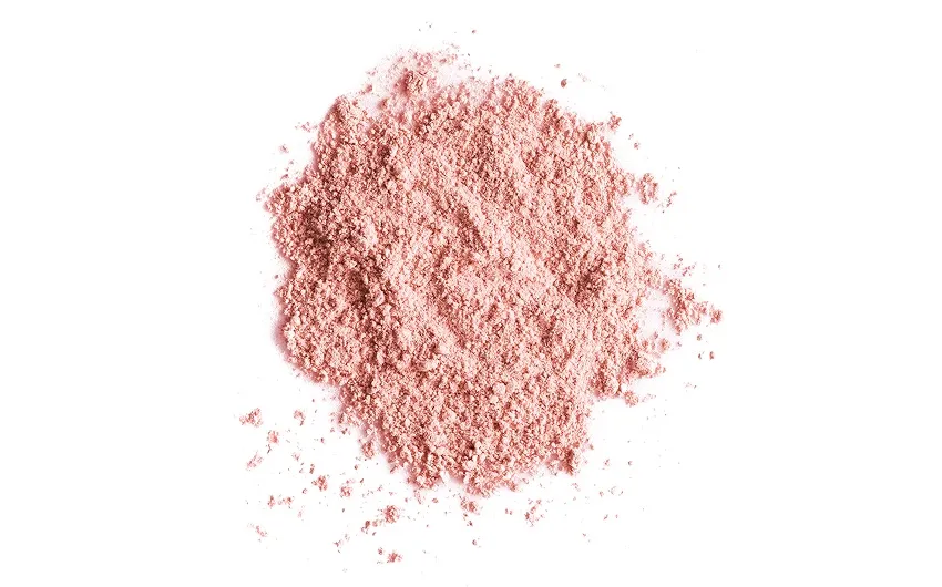 A small pile of effera™ powder on a white background.