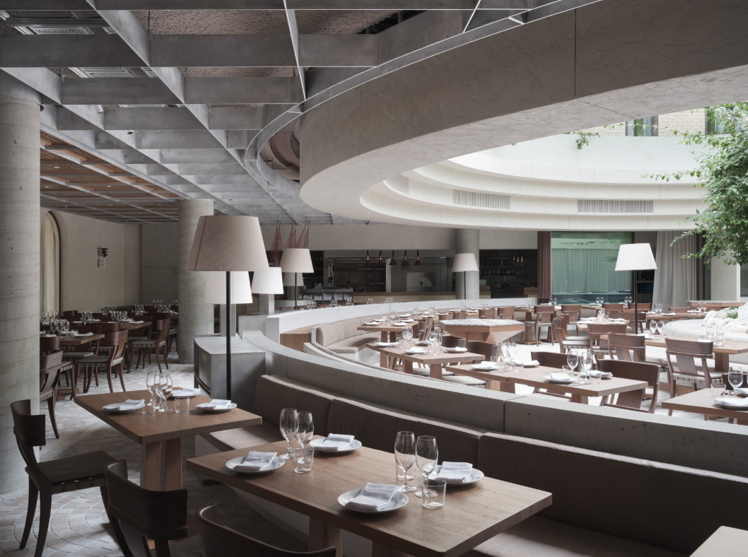 A restaurant with tables and chairsAI-generated content may be incorrect.