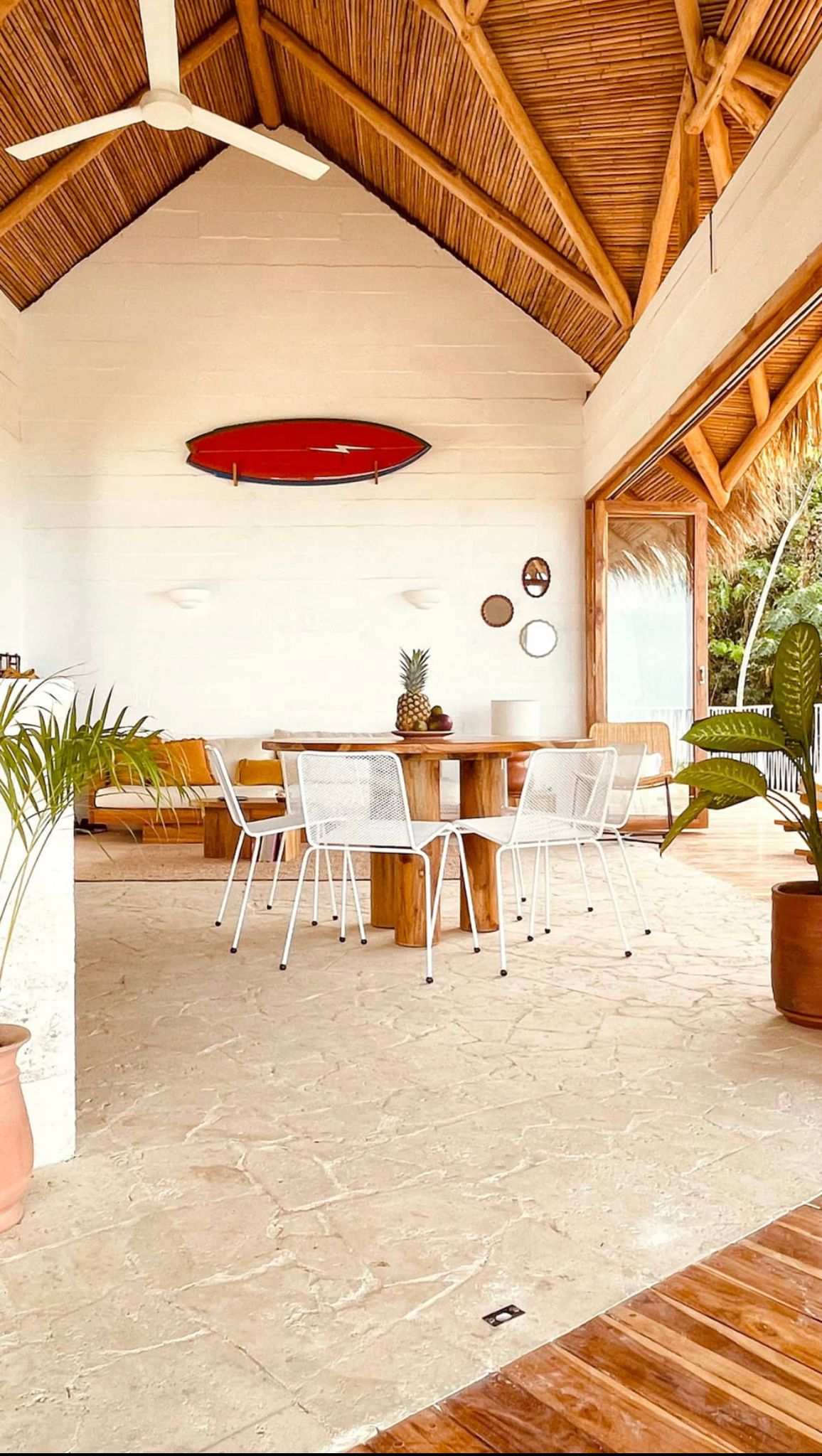 A surfboard on a wall mount in costa rica