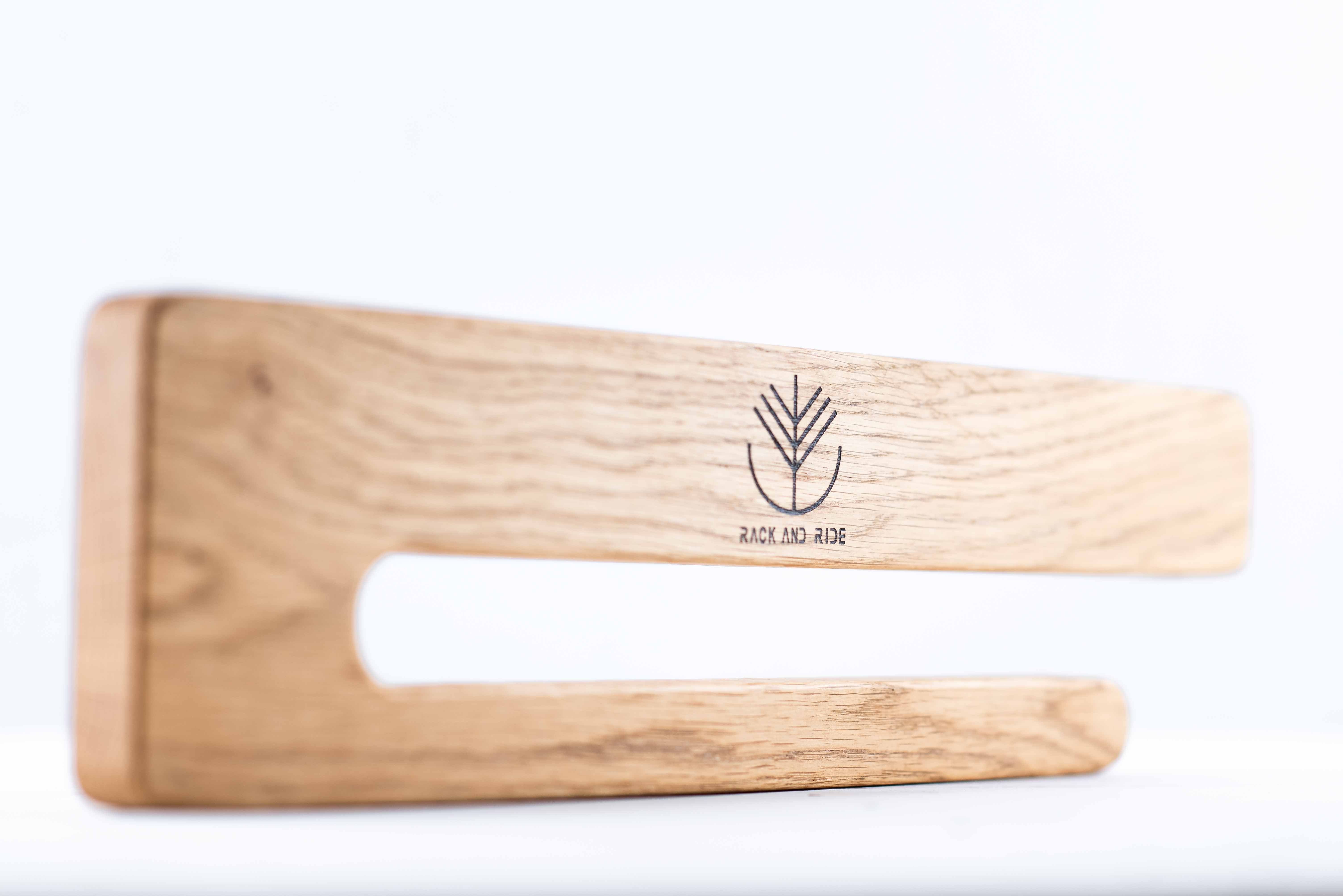 Vertical wall skateboard rack displaying a skateboard as a decorative element in a modern room