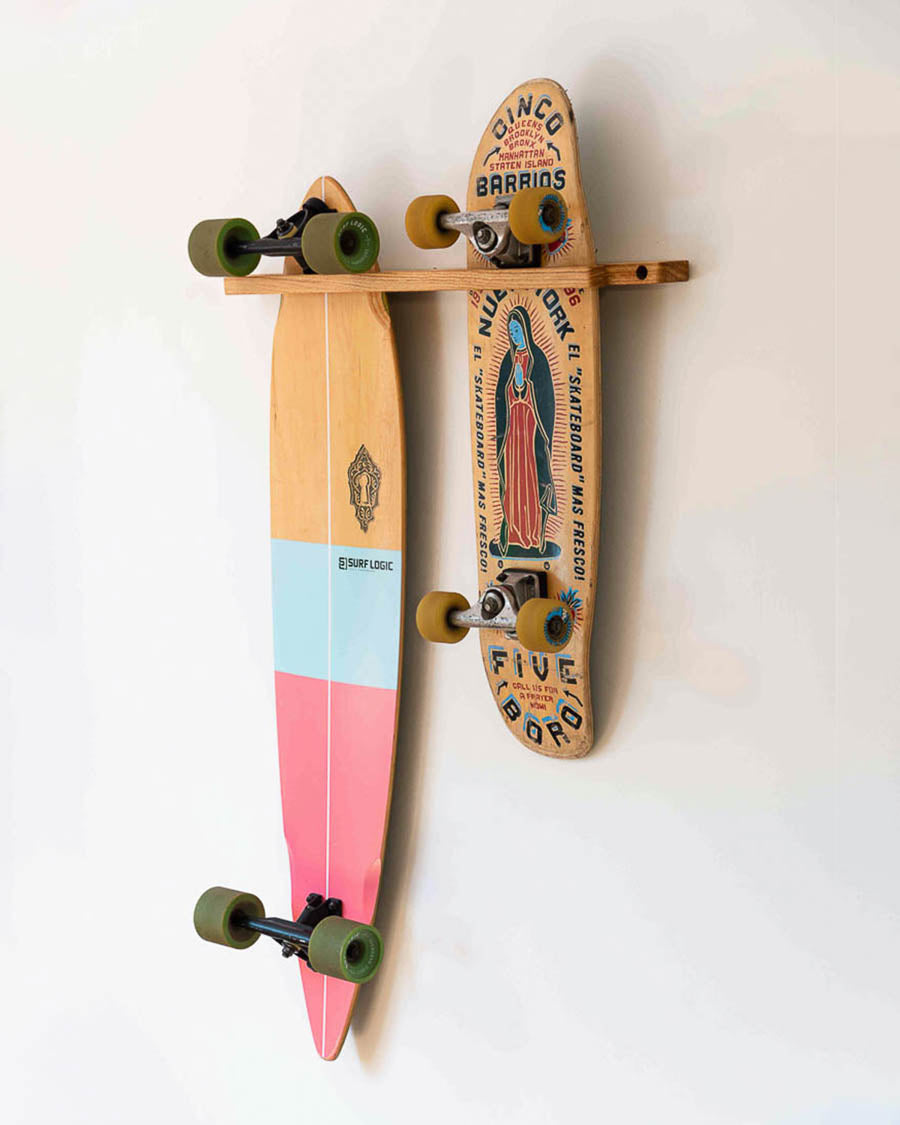 Wooden double vertical skateboard wall mount holding a longboard and a cruiser