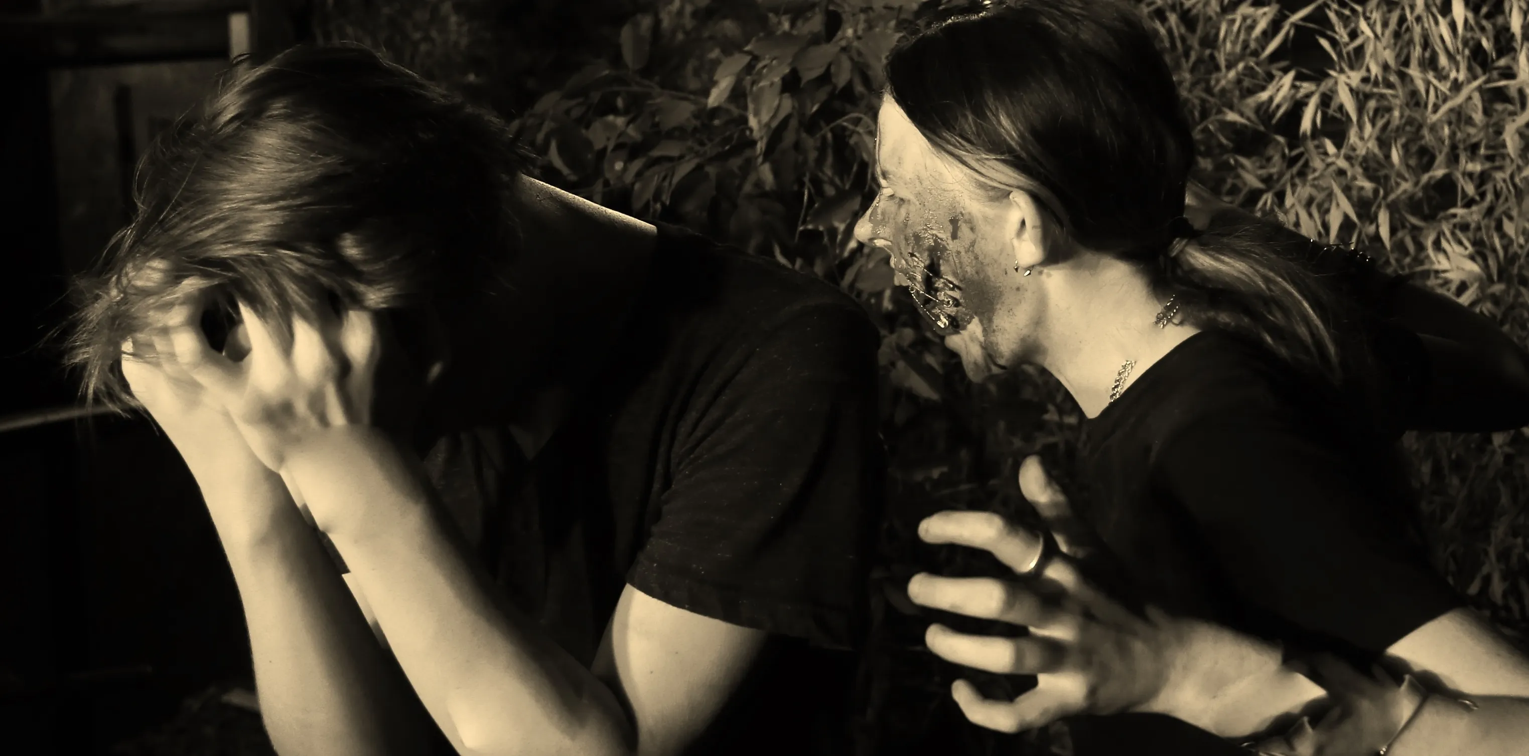A man and a woman sitting next to each other.