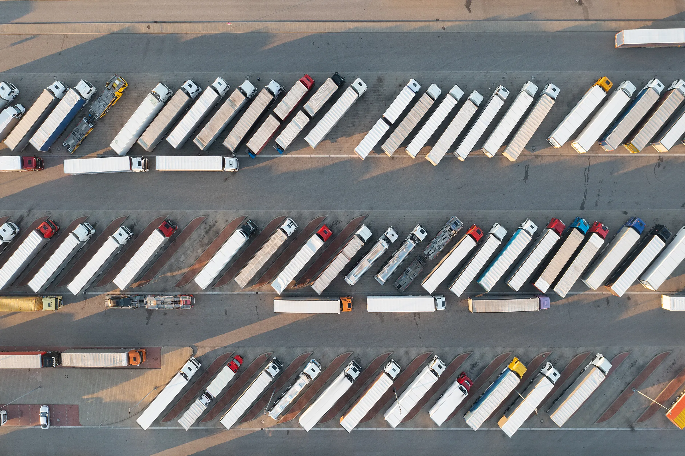 Rows and rows of trailers sitting in a parking lot