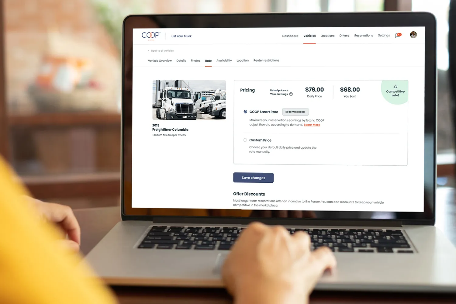 Person sitting at a laptop using the COOP platform