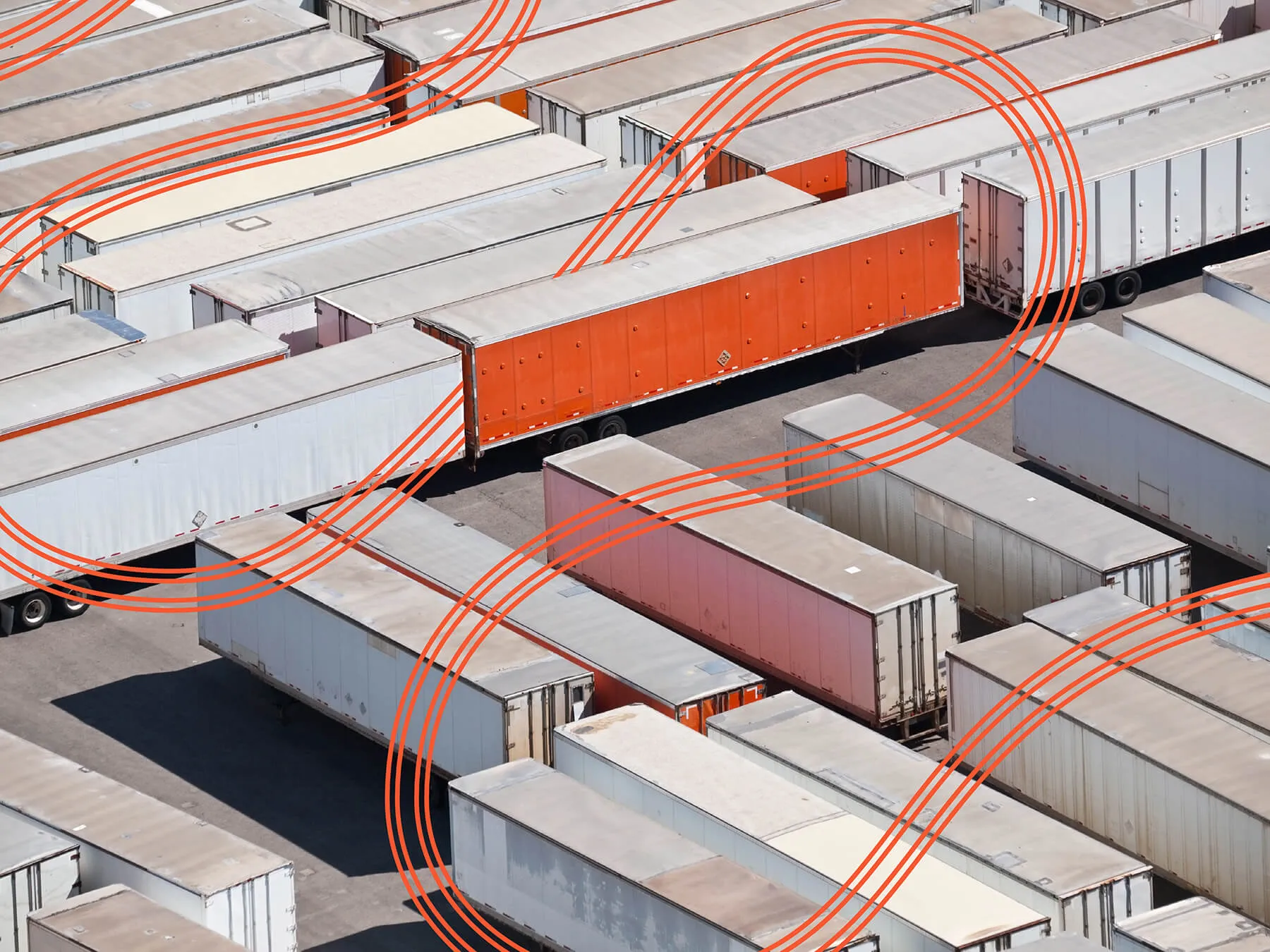 Rows and rows of trailers sitting in a parking lot