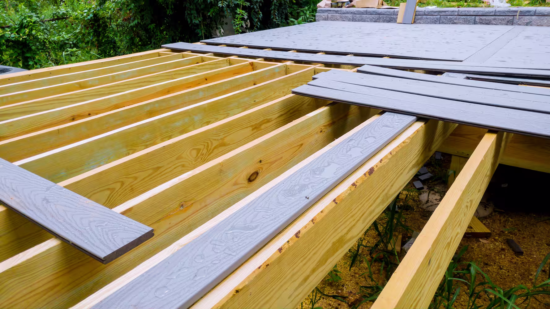 A deck having composite deck boards installed. 