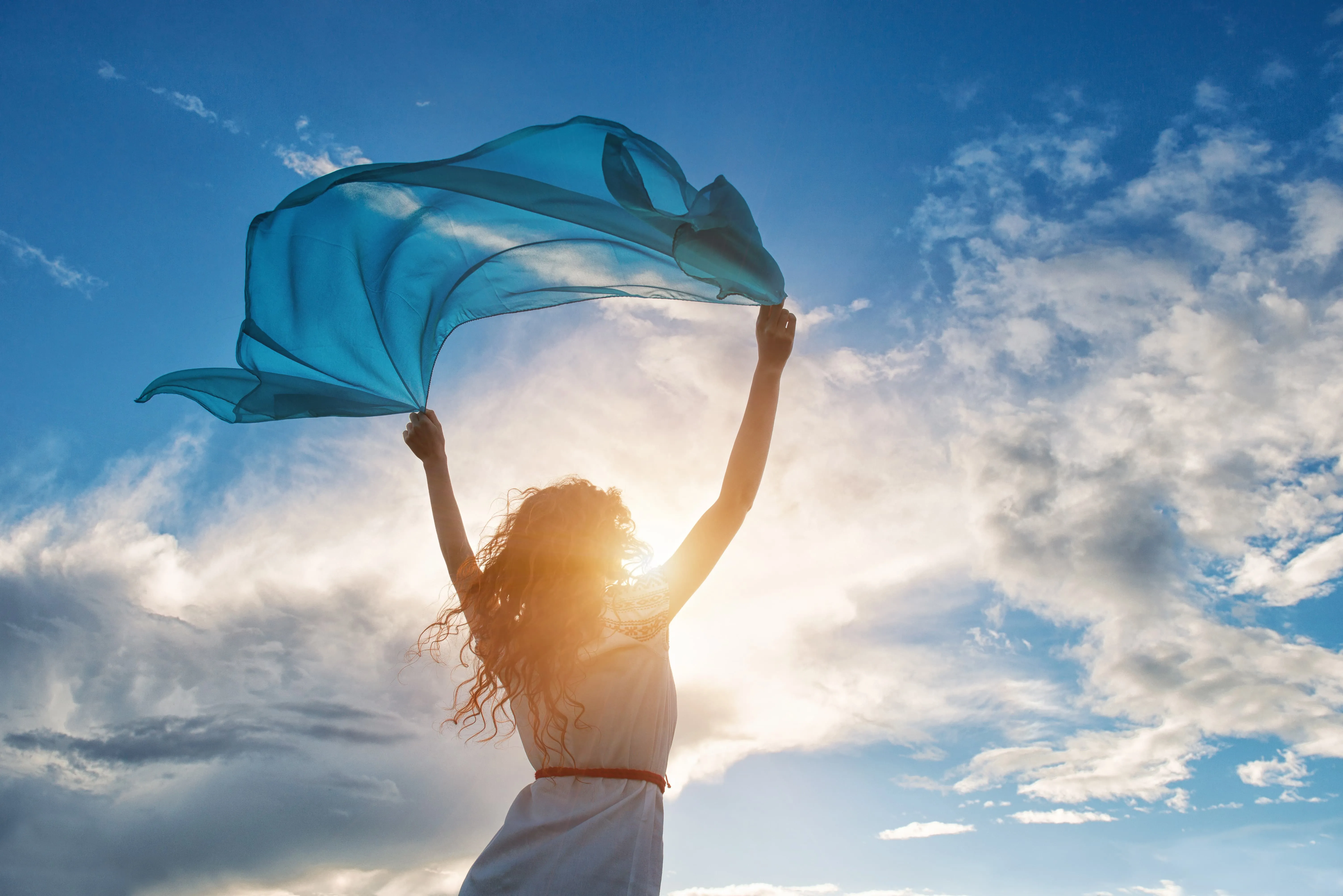 Woman waving flag in air