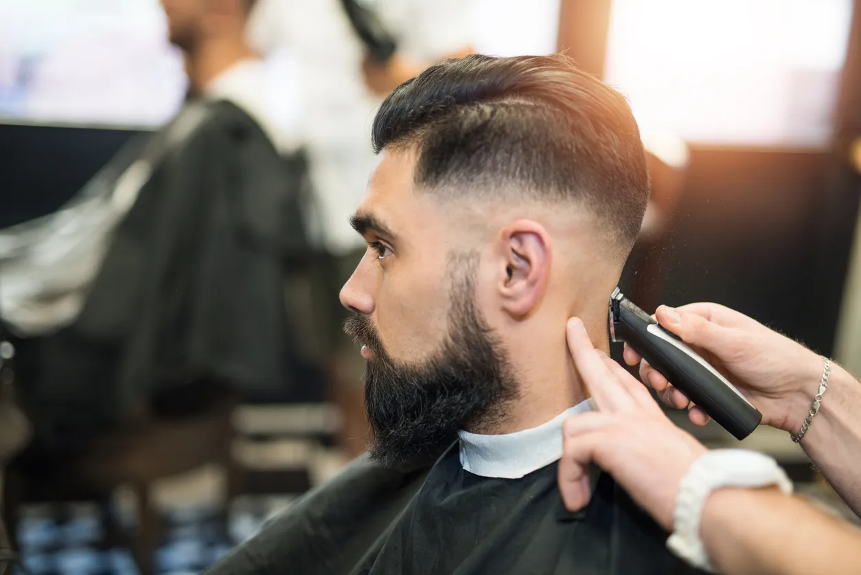 Barber giving client a fade haircut at Project Hairway Dubai