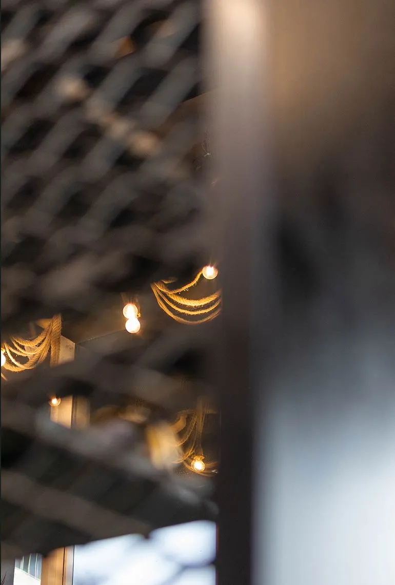 Stylish hanging light fixture inside Project Hairway Dubai barbershop